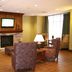 Hampton Inn & Suites Boise/Nampa at the Idaho Center lobby seating area with fireplace and TV in Nampa