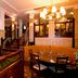 Premier Inn Christchurch - East lobby with staircase, chandeliers and dining tables in Christchurch