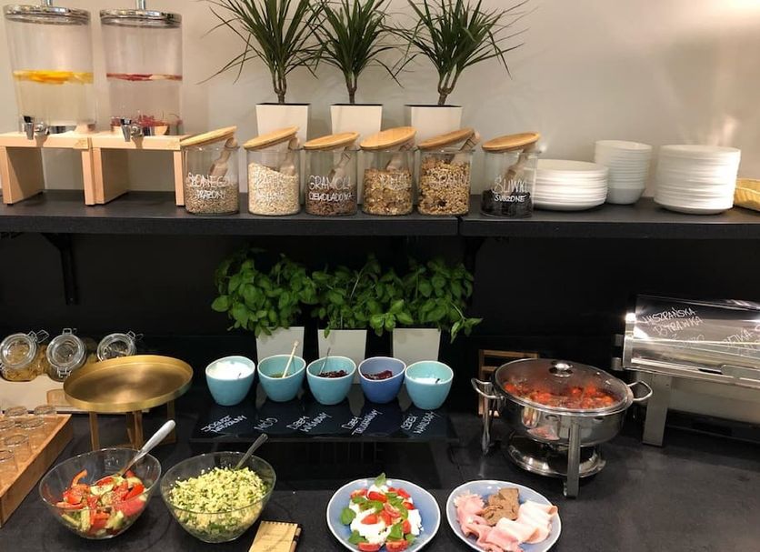 Villa Ozone in Sopot breakfast buffet with cereal dispensers, fruit bowls, salads, and hot dishes