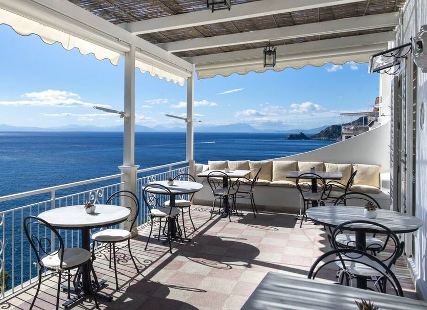 Maresca Hotel Praiano terrace with tables and chairs overlooking the sea in Praiano