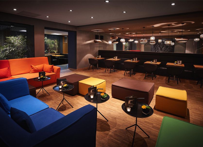 Hotel Zugbrücke Grenzau lounge with colorful seating and bar area in Hohr Grenzhausen