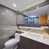 Adange Hotel Lijiang bathroom with vanity, toilet, large mirror and walk-in shower