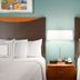 Fairfield Inn & Suites by Marriott South Bend Mishawaka room with two beds and bedside lamp in Mishawaka