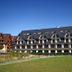 Hotel Paryski Art & Business in Zakopane, exterior with chalet-style facade and grassy lawn