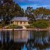 Stonewell Cottages and Vineyards in Tanunda, lakeside cottage with trees reflected in still water