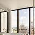 Capella Sydney bathroom with freestanding tub and floor-to-ceiling windows overlooking Sydney city skyline