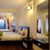 Summit Namnang Courtyard & Spa, Gangtok: spacious guest room with twin beds and mountain-view window