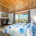 Little Creek Cove Beach Resort in Newport bedroom with ocean-view balcony and fireplace