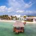 Margaritaville Island Reserve Riviera Cancun in Puerto Morelos with beachfront, clear turquoise water and overwater palapa