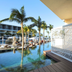 TRS Coral Hotel in Cancún: adults-only poolside cabana with ocean-view palms and lounge chairs