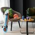 Moxy Milton Keynes lounge with chair, sofa, skateboard, backpack and coffee table
