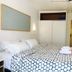 La Caleta de Tamariu guest room in Tamariu with twin beds, ceiling fan and sliding closet doors
