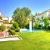 Doña Urraca Hotel & Spa in Santiago de Querétaro with lush garden, pool and white buildings