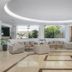 Niriides Beach in Kolympia lobby lounge with beige sofas, plants, and large windows