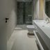 Hotel Bavaria Blu bathroom in Mamaia with glass shower, wall-mounted toilet and long vanity sink