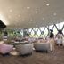 The New Ronacher Thermal Spa Hotel lounge with bar seating and mountain-view windows in Bad Kleinkirchheim
