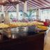 Bosque do Porto Praia Hotel in Porto Seguro buffet with tropical fruit and pastries in dining area