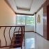 OYO 389 Sira Boutique Residence in Patong, interior hallway with elevator, stairs and windowed mountain view