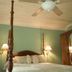 The Garden Walk Bed & Breakfast in Lookout Mountain guest room with four-poster bed and ceiling fan