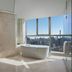 Beijing Marriott Hotel Northeast bathroom with freestanding tub and city skyline view in Beijing