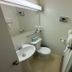 Lake-Vu Motel Kenora bathroom with sink, toilet, towel rack, and walk-in shower