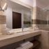 Krystal Puerto Vallarta bathroom with marble vanity, walk-in shower and folded towels
