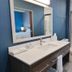 Home2 Suites by Hilton Pensacola I 10 Pine Forest Road bathroom with vanity, sink, toilet and walk-in shower