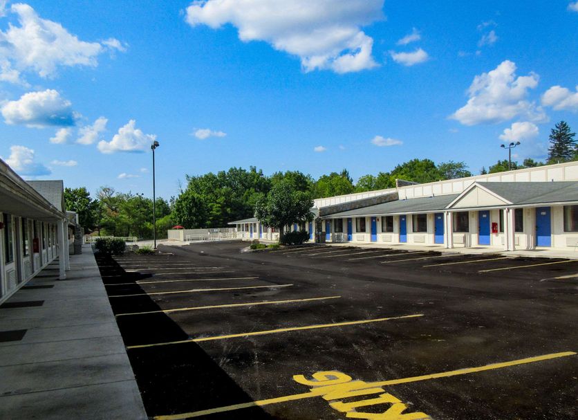 Rodeway Inn Altoona Orchard Plaza in Altoona exterior with empty parking lot and motel rooms