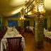 Mbuzi Mawe Serena Camp dining tent in Serengeti with stone pillars and set tables