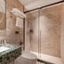 24k International Hotel People's Square bathroom in Shanghai with glass shower and marble sink
