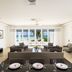 Coral Beach Club Villas & Marina in Upper Prince's Quarter living area with ocean-view terrace and seating