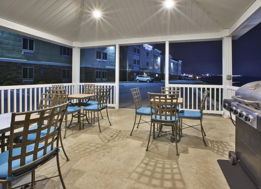 Candlewood Suites Morgantown-Univ West Virginia By IHG patio with tables, chairs and grill at night