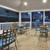 Candlewood Suites Morgantown-Univ West Virginia By IHG patio with tables, chairs and grill at night