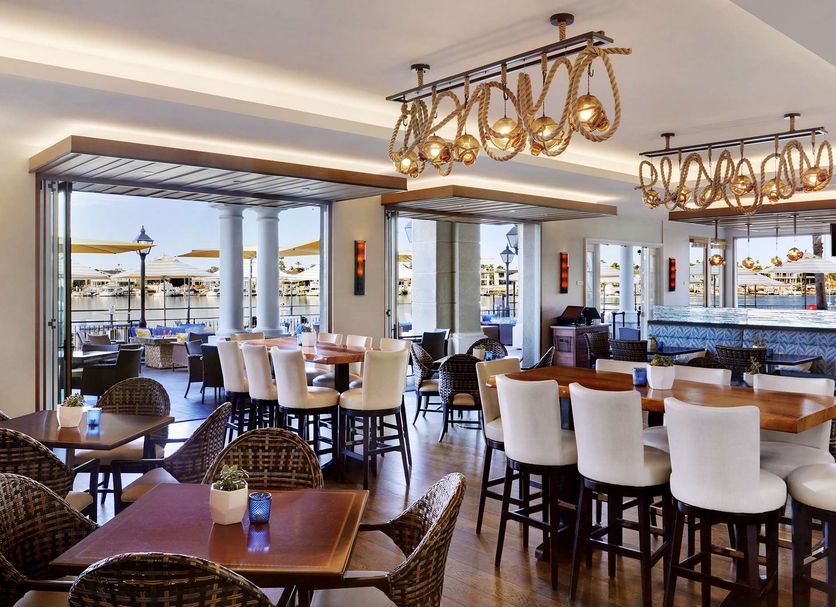 Balboa Bay Resort in Newport Beach dining area with bar seating and marina views