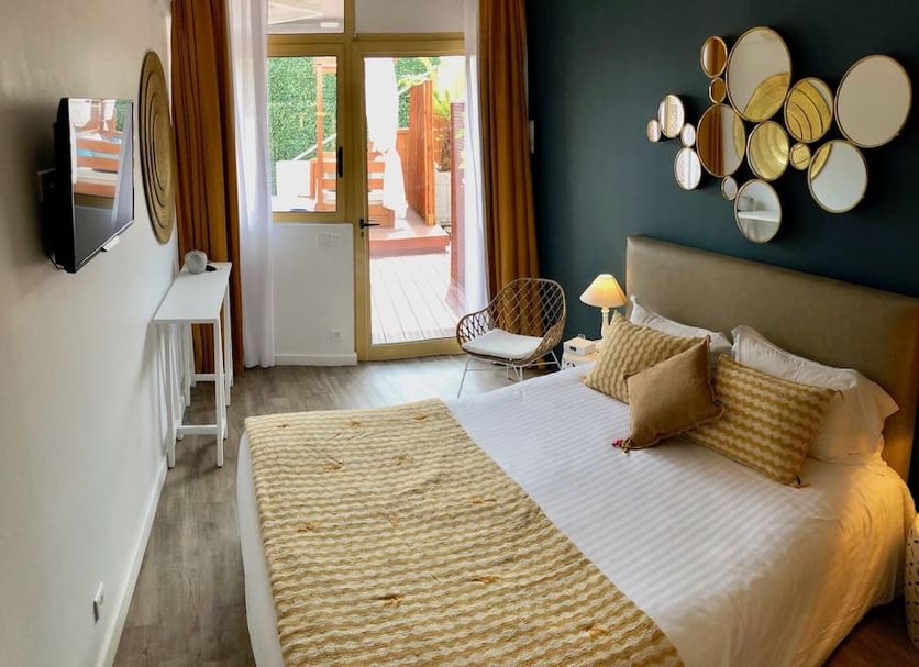 Boutique Hotel & Spa la Villa Cap Ferrat bedroom with balcony door and wall decor, Saint-Jean-Cap-Ferrat