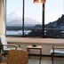 Yamadaya Hotel in Fujikawaguchiko room with Mt. Fuji view through large window and seating area