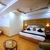 Grand Legacy Beacon, Dehradun guest room with two double beds and a seating area
