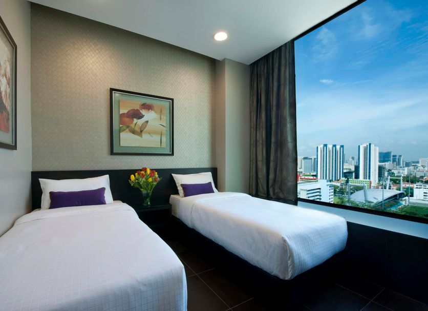 V Hotel Lavender Singapore twin room with large city skyline view through floor-to-ceiling window