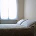 Hotel Meublè Adler - Rooms & Mountain Apartments room with bed, window and bedside table in Santa Caterina Valfurva
