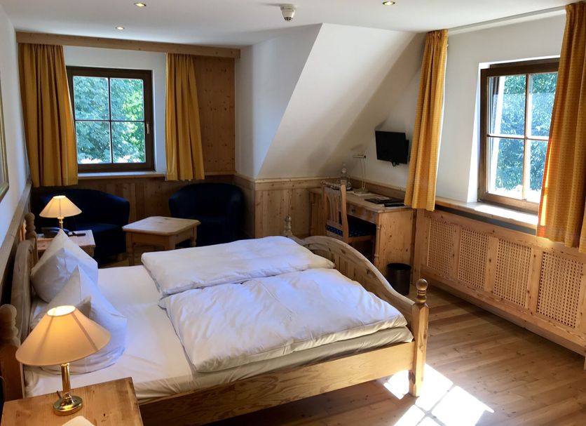 Schloss Diedersdorf room in Diedersdorf with wooden bed, two windows and sitting area