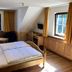 Schloss Diedersdorf room in Diedersdorf with wooden bed, two windows and sitting area