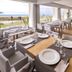 Bel Air hotel restaurant with seaside views and tables overlooking Castelldefels beach