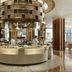 Langham Place Xiamen hotel buffet restaurant with circular food display and chefs