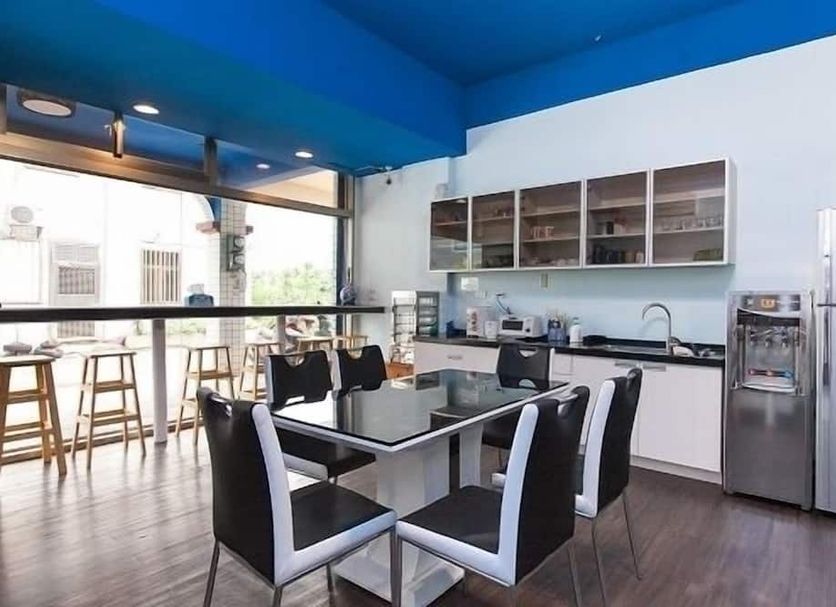 Wm&s B&b Xincheng Township kitchen dining area with bar stools and stainless refrigerator