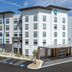 Tru by Hilton Lumberton exterior in Lumberton, featuring a modern multistory hotel and parking lot