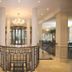 Upstalsboom Heringsdorf lobby with chandelier, columns and curved railing in Heringsdorf