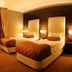 Rota Bulvar Hotel Ankara guest room with two single beds and warm ambient lighting