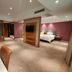 Wanhao International Hotel in Benxi spacious suite with bedroom, lounge, TV, and dining area