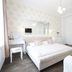 Wellness Pension Ametyst in Český Krumlov bedroom with mirrored wardrobe and white bed