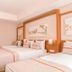 Venosa Beach Resort And Spa in Didim guest room with twin beds and wood flooring